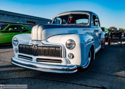 Mercury grille badge and chrome bars on a postwar coupe at a Richmond Hill car meet, Leica Q3
