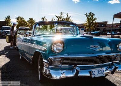 1956 Chevrolet Bel Air convertible with the top down, turquoise body glowing in low sun, Leica Q3