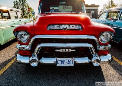 Head-on grille of a 1957 GMC 9300 with the block GMC lettering and an Ontario plate, Leica Q3