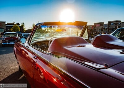 The red Bullet Bird front three-quarter with the sun flaring over the hood, Leica Q3