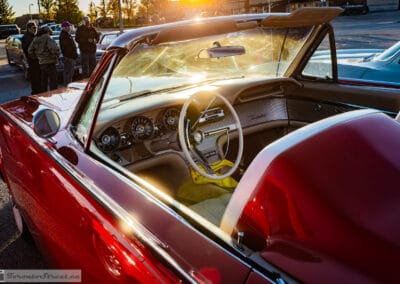 Moulded tonneau headrests and Kelsey-Hayes wire wheels backlit by the low sun, Leica Q3