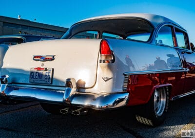 Rear of a two-tone Bel Air, teardrop lights, Chevy crest and dual exhaust in golden light, Leica Q3
