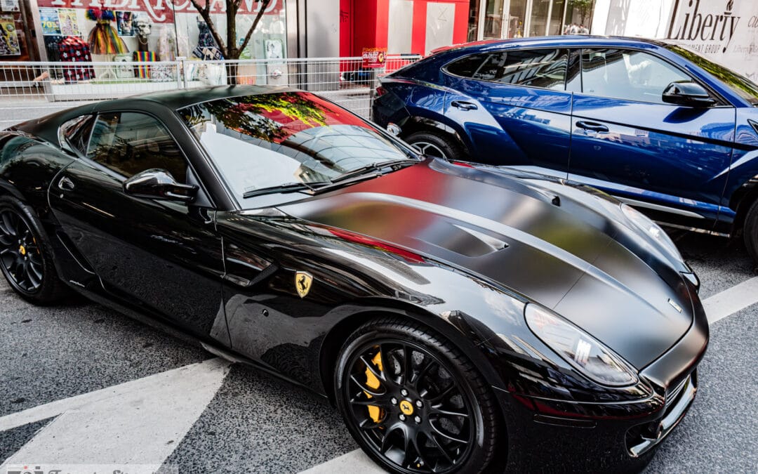 Ferrari 599 GTO in Toronto, matte black hood and prancing horse grille in hard sun, Yorkville car show, Leica Q3