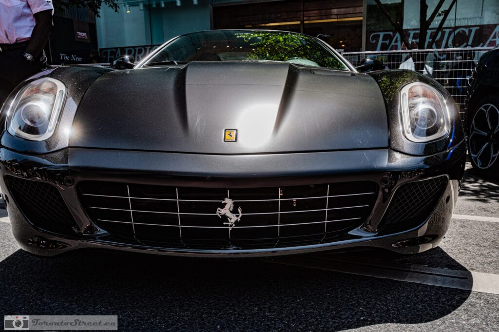 Ferrari 599 GTO--1001042 Ferrari 599 GTO seen head on, matte black hood and prancing horse grille in hard sun, Yorkville car show, Leica Q3
