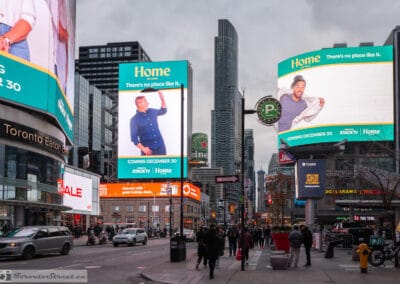 Colourful city street photography of Yonge-Dundas billboards and the Eaton Centre under grey cloud, Leica Q3