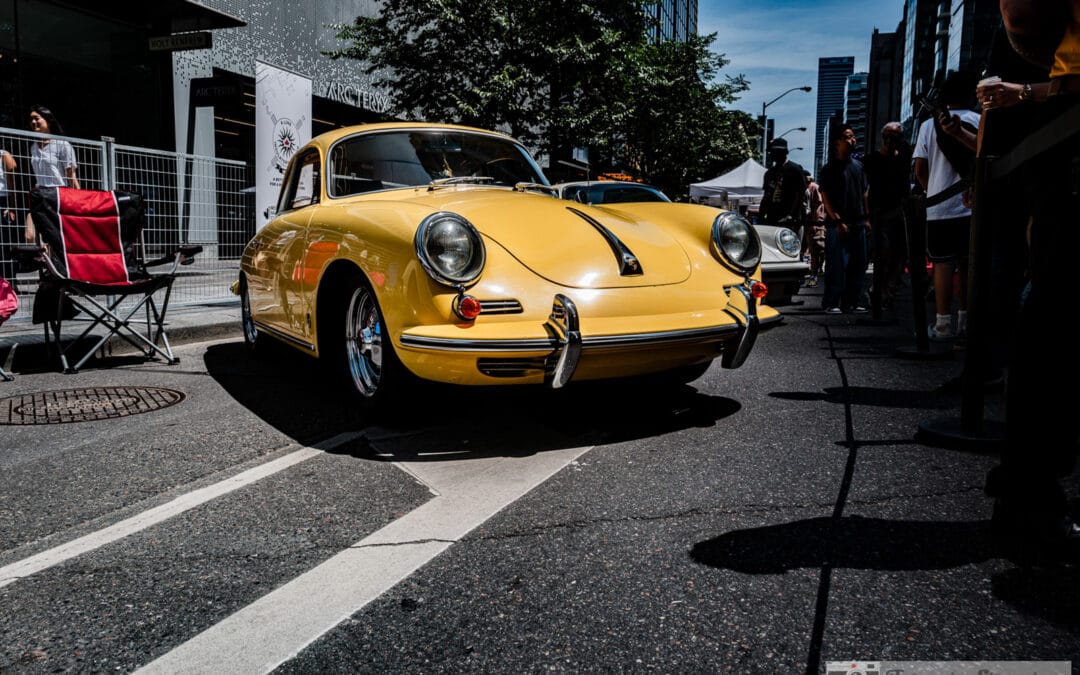 Yellow Porsche 356 on Bloor Street with the Yorkville crowd and downtown towers, Leica Q3