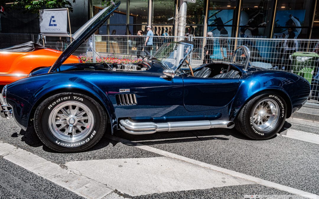 Shelby Cobra 427 roadster side profile with chrome side pipes on Bloor Street, Leica Q3