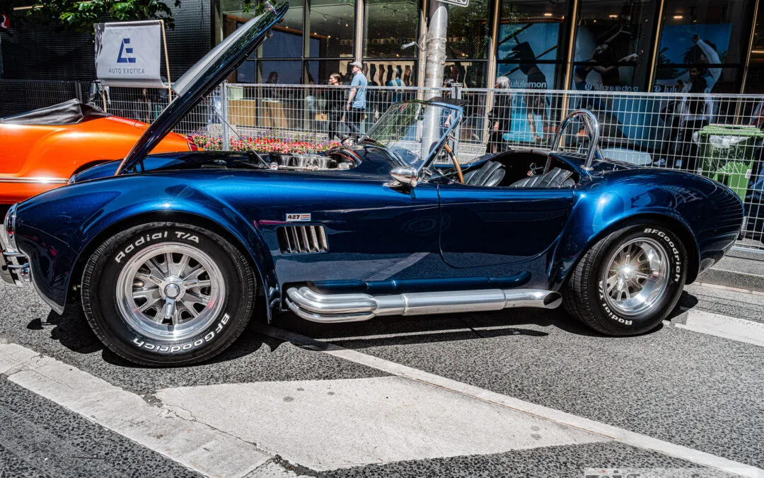 Shelby Cobra 427 roadster side profile with chrome side pipes on Bloor Street, Leica Q3