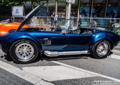 Shelby Cobra 427 roadster side profile with chrome side pipes on Bloor Street, Leica Q3