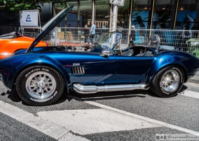 Shelby Cobra 427 roadster side profile with chrome side pipes on Bloor Street, Leica Q3