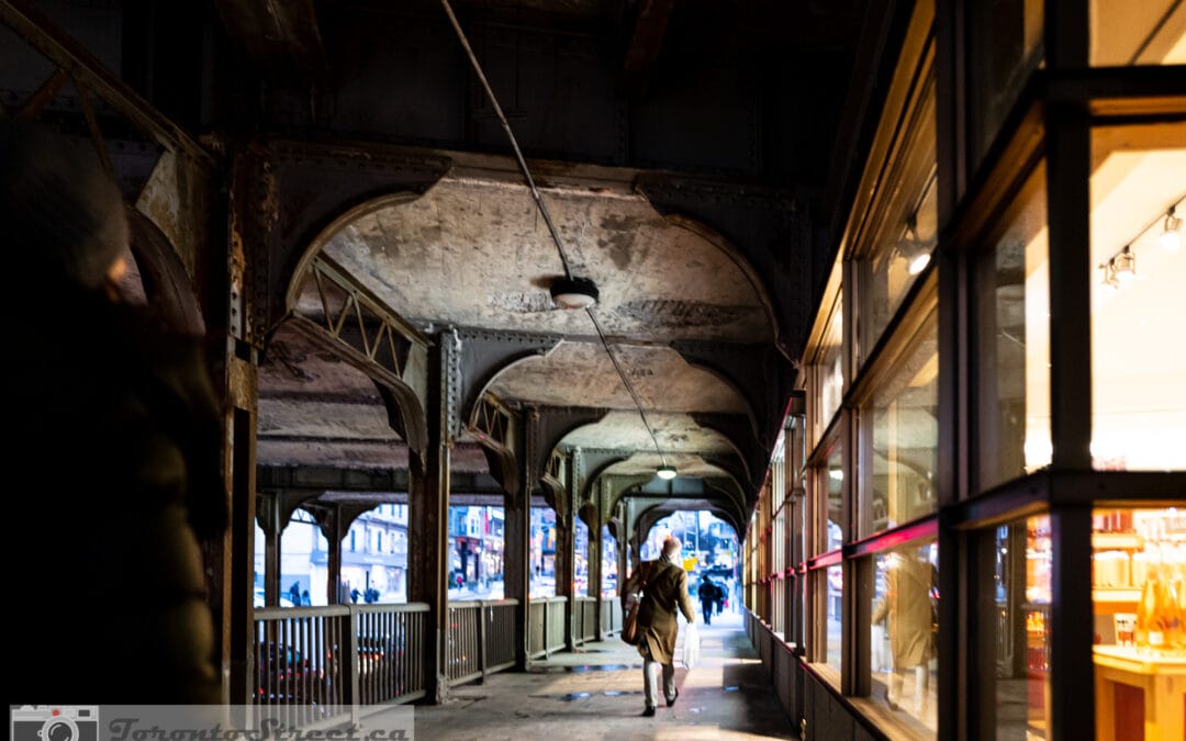 Woman walking through the Victorian iron arches on Yonge Street, yonge street photography, Leica Q2