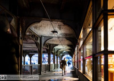 Woman walking through the Victorian iron arches on Yonge Street, yonge street photography, Leica Q2