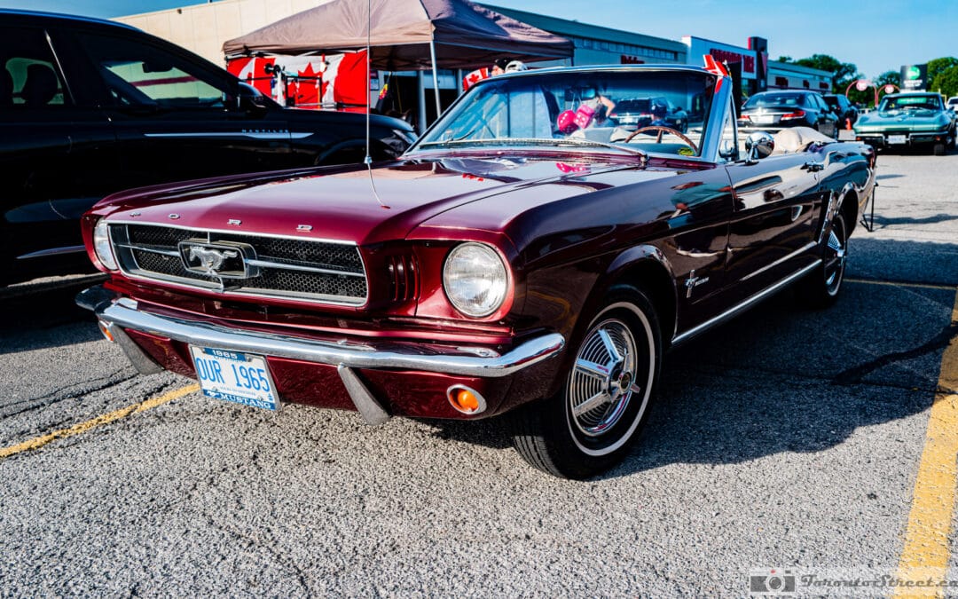 1965 Ford Mustang convertible in burgundy with the top down at a Richmond Hill cruise night, Leica Q3