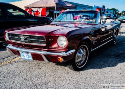 1965 Ford Mustang convertible in burgundy with the top down at a Richmond Hill cruise night, Leica Q3