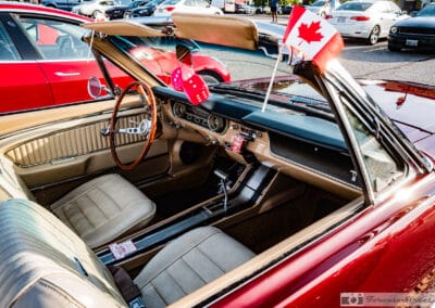 Tan interior of the 1965 convertible, wood rim wheel, sweep speedometer and pink dice, Leica Q3