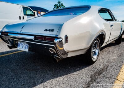 Rear quarter of the Oldsmobile showing its 442 badge, tail lights and chrome bumper, Leica Q3