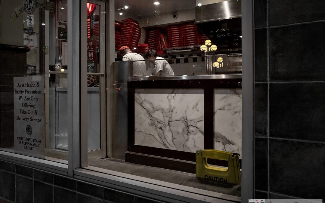 Toronto restaurant windows during the closures, two cooks behind a marble counter, take-out only sign, Leica Q2