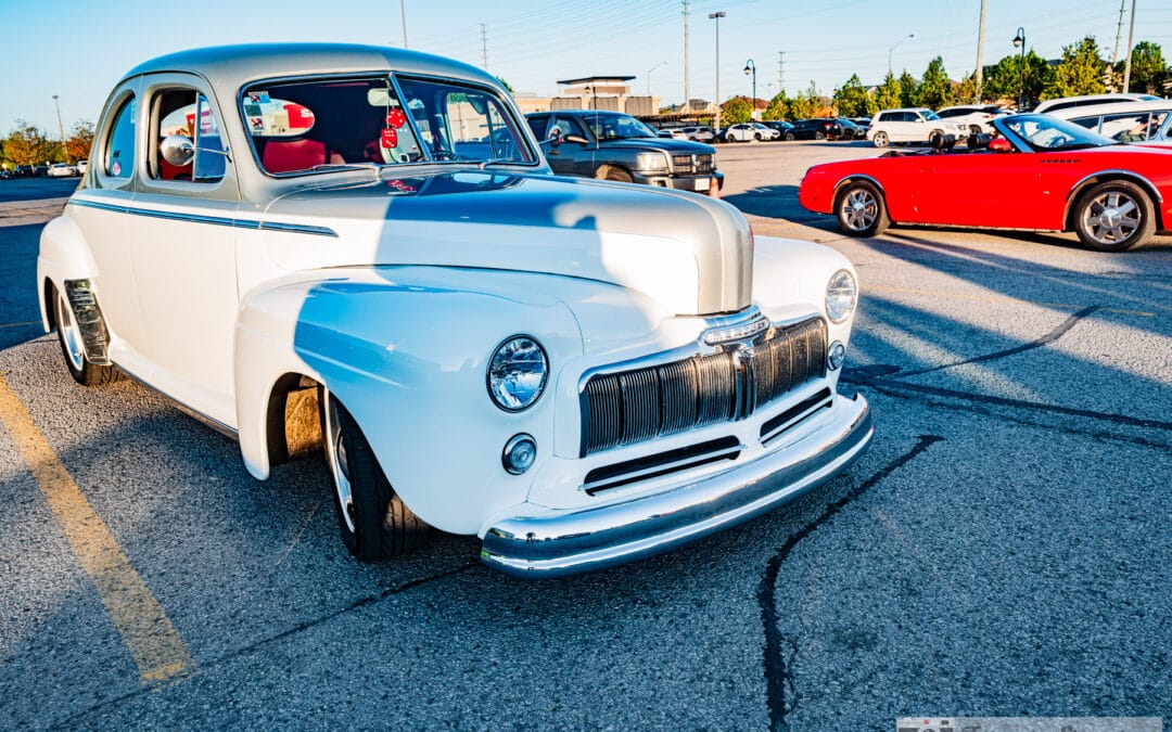 White 1948 Mercury restomod coupe with a man's shadow across its hood, Richmond Hill north of Toronto, Leica Q3