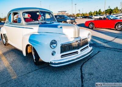 White 1948 Mercury restomod coupe with a man's shadow across its hood, Richmond Hill north of Toronto, Leica Q3