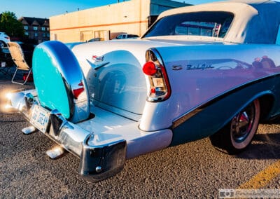 Rear three quarter of a turquoise Tri-Five Chevrolet with the top up, whitewalls and chrome, Leica Q3