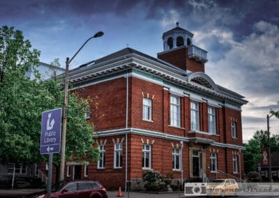 Red brick Victorian library with a white cupola against a dark suburban GTA sky, Bowmanville, Fuji X-E2