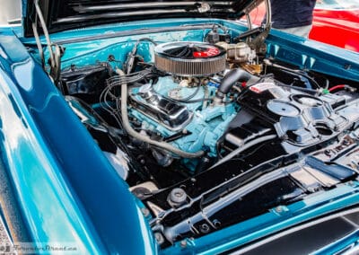 Chrome valve covers and braided fuel line on a freshly detailed Pontiac V8, hood open, Richmond Hill, Leica Q3
